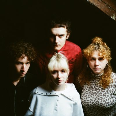 Laundromat Chicks band pic in dark attic
