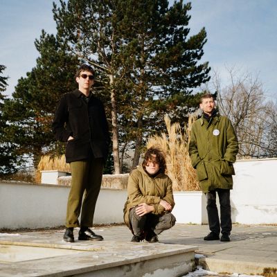Bad Weed press picture. 3 lads, 2 in parkas, one with sunglasses.