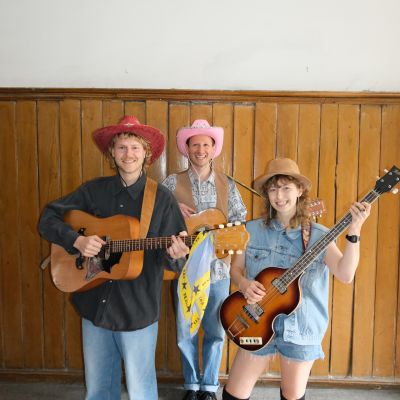 The group with Cowboy Hats and guitars!